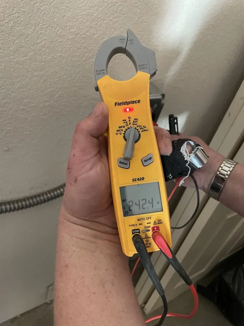 Voltage testing with clamp meter during Generator Installation in Millburn